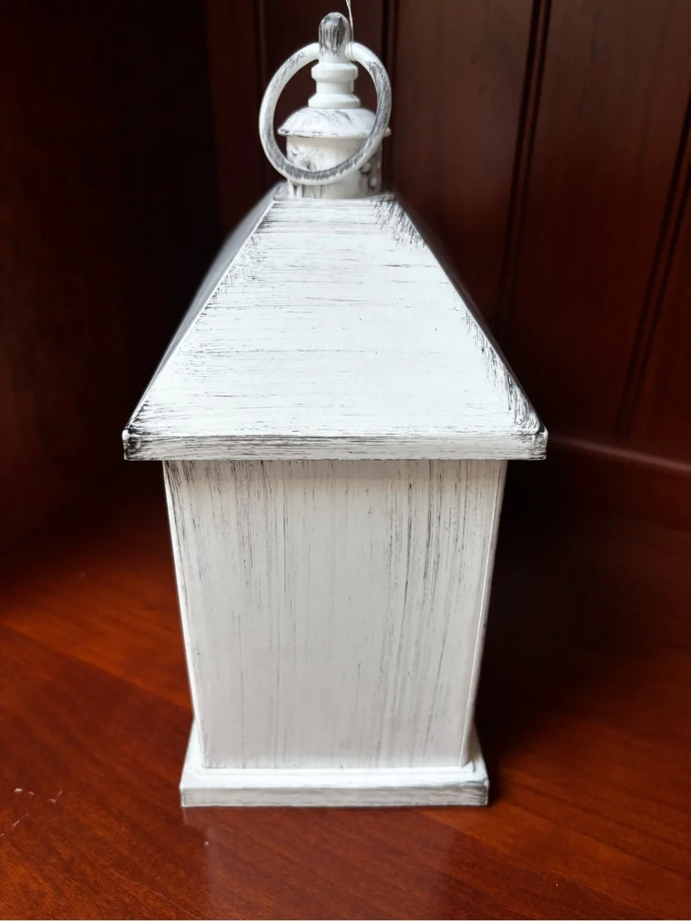 A Cheerful Giver Flameless White Fireplace Lantern distressed white finish .